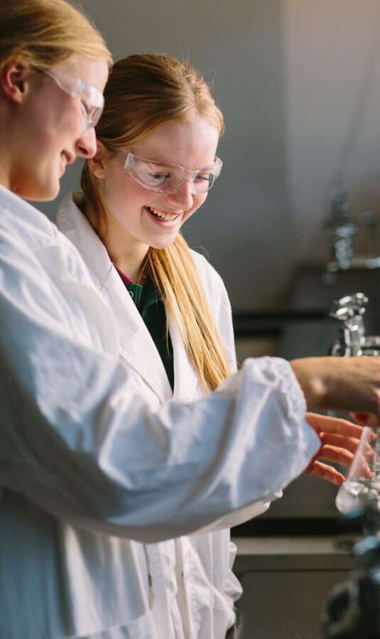 Students in lab coats.